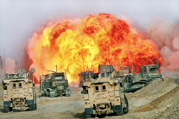 foto - U.S. Marines wait in their vehicles as a charge detonates...in the Sangin district in Afghanistans Helmand province,.jpg